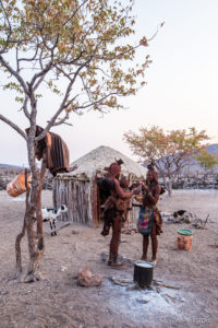 Two Himba Preparing Gruel, Kunene Region Namibia