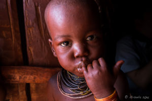 Portrait: Female Himba toddler, Kunene Region, Namibia