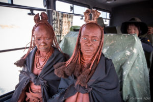 Old Himba women in blankets in a Truck, Kunene Region, Namibia