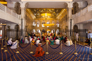 People seated in the prayer hall, , Gurudwara Sis Ganj Sahib, Delhi