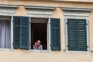 Man smoking in an Altstad Window, Lucerne Switzerland