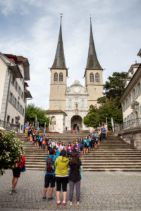 Tourists on the Steps of Church of St. Leodegar, Lucerne Switzerland
