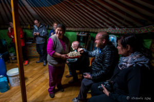 Tourists and Nomads Inside a Mongolian Ger