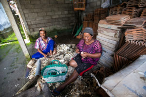 A Balinese couple carving tourist trinkets, Gianyar