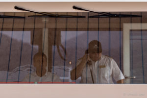 Two Men in a Danube canal-boat wheelhouse, Wachau Austria