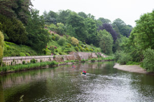 Canoes on the Wye, The Weir riverside garden, Herefordshire, UK