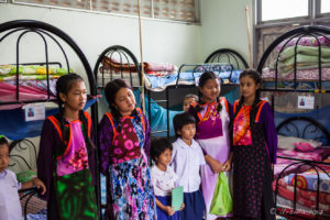 Lisu Girls in a dormitory, Chumchon Lae Luang Prasit Wittaya Primary School speaking to young pupils, Chiang Mai Thailand