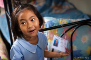 Young Lisu girl, Chumchon Lae Luang Prasit Wittaya Primary School speaking to young pupils, Chiang Mai Thailand