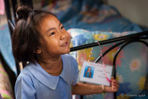 Young Lisu girl, Chumchon Lae Luang Prasit Wittaya Primary School speaking to young pupils, Chiang Mai Thailand