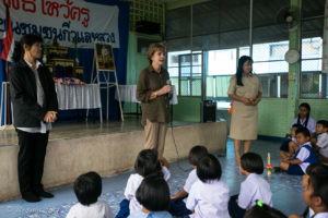 Susan Race from THEP and the Headmistress of Chumchon Lae Luang Prasit Wittaya Primary School speaking to young pupils, Chiang Mai Thailand
