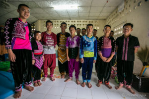 Hmong boys in traditional costume inside their Dormitory, Santisuk School, Chiang Mai Thailand