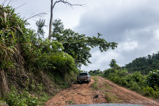 Truck on a steep, wet, red-dirt Mountain Road, Mae Hong Son Thailand