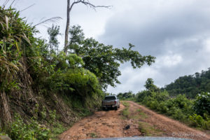 Truck on a steep, wet, red-dirt Mountain Road, Mae Hong Son Thailand