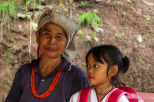Portrait: Karen Grandmother and Child in a shelter, Mae Sariang, Thailand