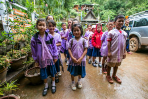 Karen children lined up in a school courtyard, Mae Sariang, Thailand