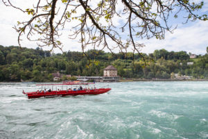 Red tourist boat on the Rhine Falls, Switzerland