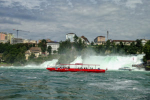 Red tourist boat on the Rhine Falls, Switzerland