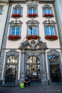 Man sitting with a shopping bag, Old Town, Schaffhausen, Switzerland