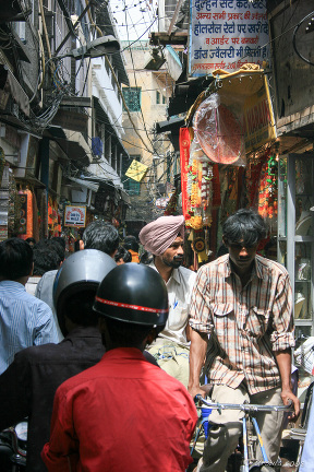 Indian people in a Crowded Laneway, Chandni Chowk Street, Old Delhi, India.