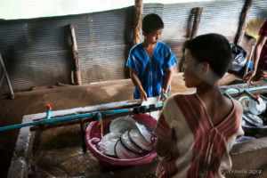 Karen school boys doing dishes at Ban Tha Song Kwae School, Mae Hong Son