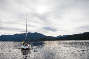 Sailboat motoring into Malaspina Strait, BC