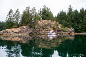 Motor boat anchored on Squirrel Cove, BC Canada