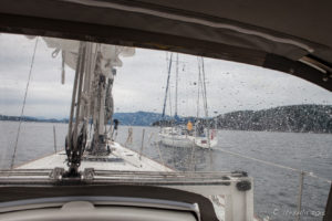 Rain on the cockpit enclosure of a sailboat, Strait of Georgia, BC Canada