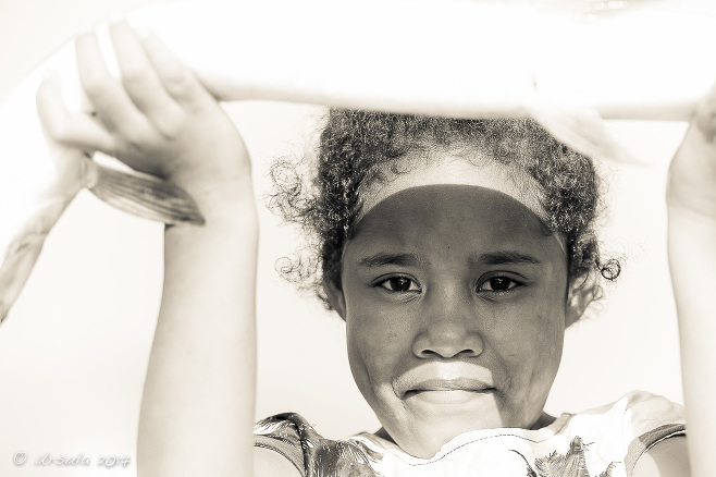 Monochrome portrait of a Papuan girl with a fish, Koki