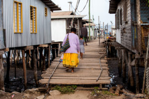 Villagers on a Gabi Hanuabada wooden walkway, Papua New Guinea