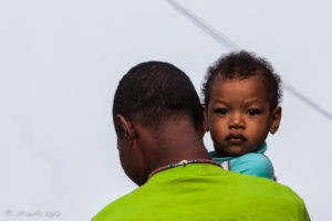 Motu child on his Daddy's Back, Hanuabada Village, Papua New Guinea