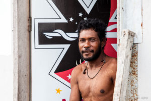 Motu man in a painted doorway, Hanuabada Village, Papua New Guinea