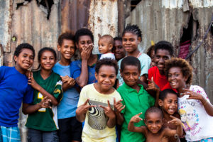 Motu children in front of corrugated iron, Hanuabada Village, Papua New Guinea