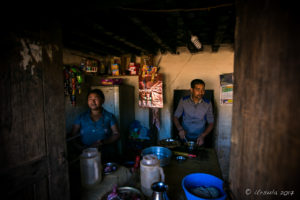 Newari man and woman making dumplings, Panauti-Namobuddha Rd, Nepal