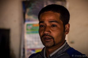 Portrait: Newari man in a dark kitchen, Panauti-Namobuddha Rd, Nepal