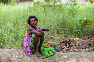 Papuan woman smoking a cheroot, Maprik PNG