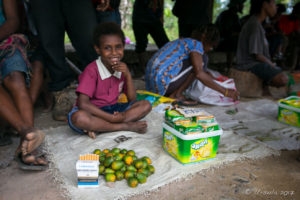 Child Selling Cigarettes and betel nuts, roadside market, Maprik PNG