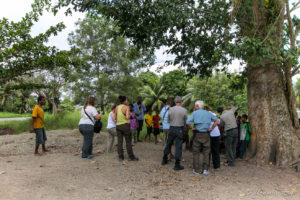 A group of foreign photographers under a tree, Maprik PNG
