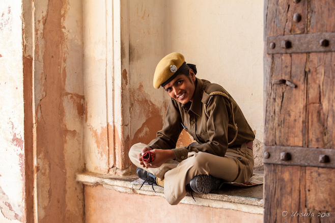 Seated Indian woman in a uniform, Amer Fort, Rajasthan