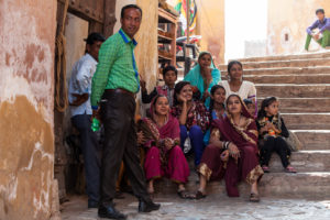 Indian family group on the steps of Amer Fort, Jaipur India