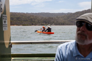 Two people in a kayak on Pambula Lake, Australia