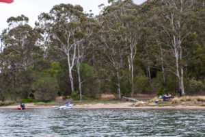Jet skis and picnickers on Pambula River, Australia