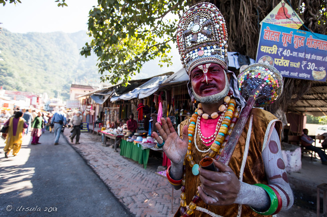 Hindu man in red face paint and silver headdress, Rishikesh India