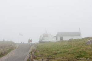 The coffee shop at Land's End shrouded in fog, Cornwall UK
