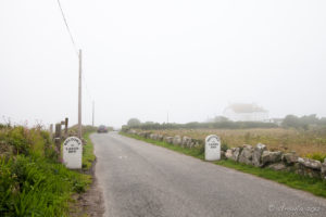 Highway markers welcoming drivers to Land's End UK.