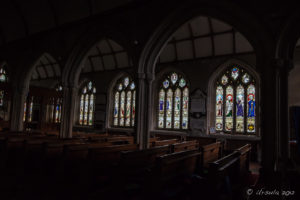 Stained glass windows inside St. Neot Church, Cornwall UK