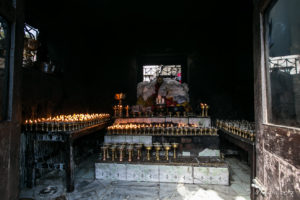 Small Shrine full of burning candles, Namo Buddha Stupa, Nepal