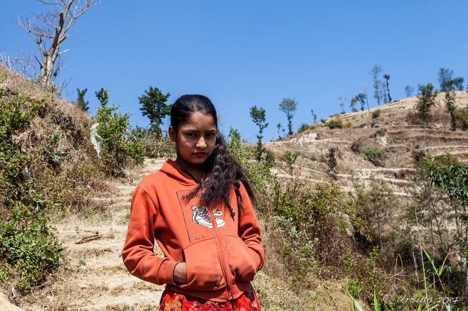 Young Nepali woman on the steps of a hill, Dhulikhel to Nagarkot, Nepal