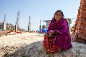 Old Nepali woman in a pink blanket, Dhulikhel to Nagarkot, Nepal