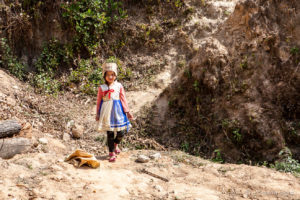 Young Nepali girl in a Cardboard Hat