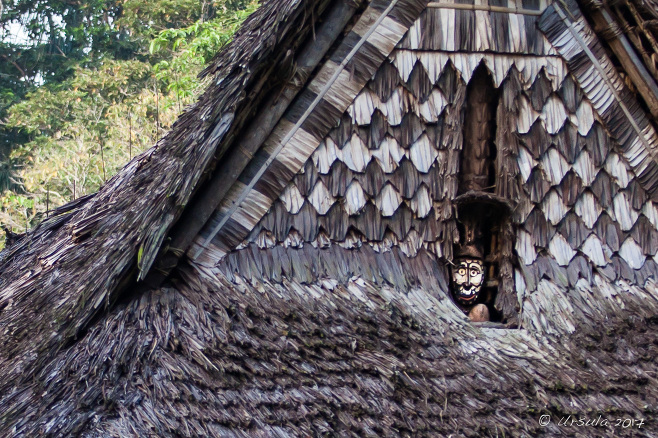 Sepik mask in the gable of the little spirit house, Kanganaman Village PNG